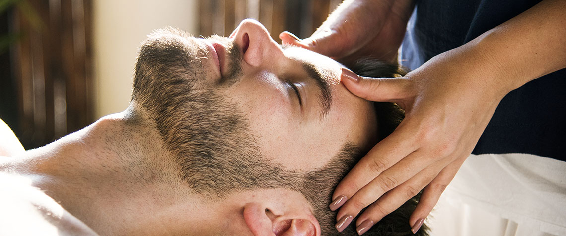 Woman relaxing from a spa treatment. How many grams of shroom should you take to microdose?