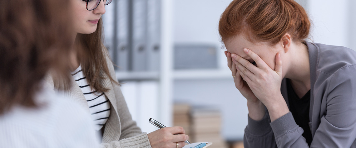 Sad woman crying during psychotherapy. benefits of medicinal mushrooms. buy shrooms online.