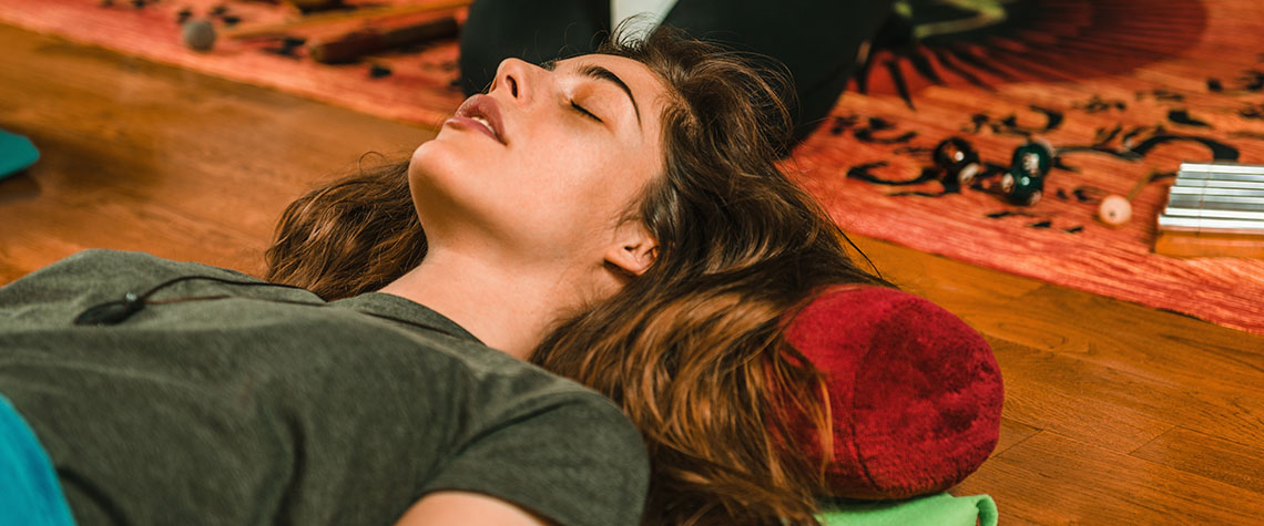 woman laying on pillow therapy. Buy golden teacher mushrooms & blue meanie shrooms online in Canada.