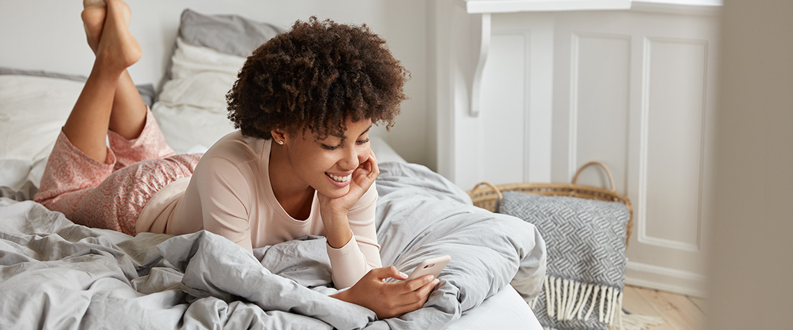 Relaxed woman on phone. What do mushrooms feel like? Buy albino penis envy shrooms online in canada.